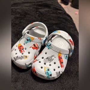 CROCS Kids White Clogs with Red, Blue, Yellow and Gray Car Prints